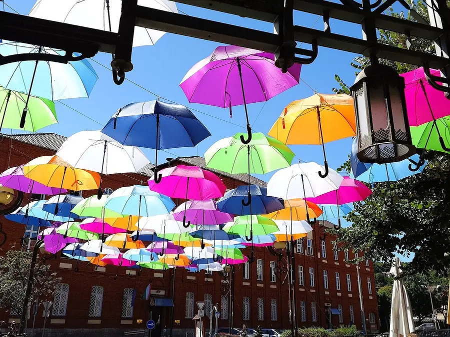 Umbrellas over a street, in typical color vision