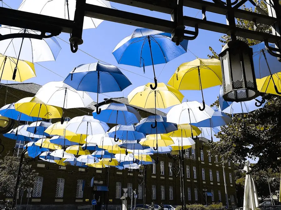 Umbrellas over a street, simulated as protan color vision