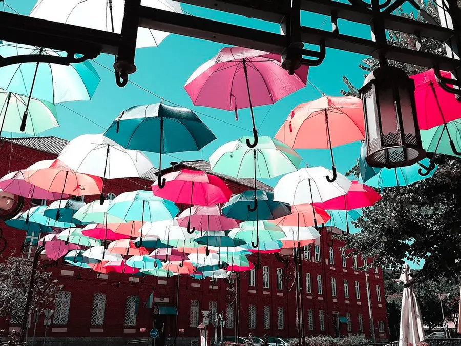 Umbrellas over a street, simulated as tritan color vision